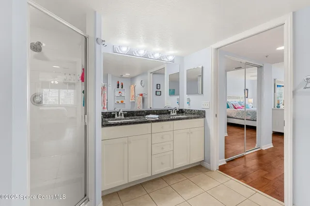 a bathroom with a toilet a sink and a shower