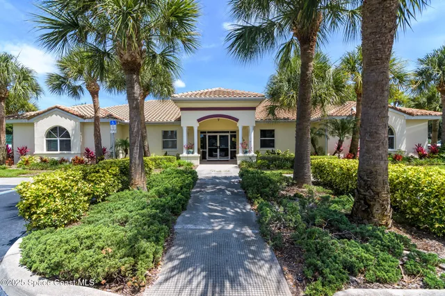 a utility room with wooden floor and furniture