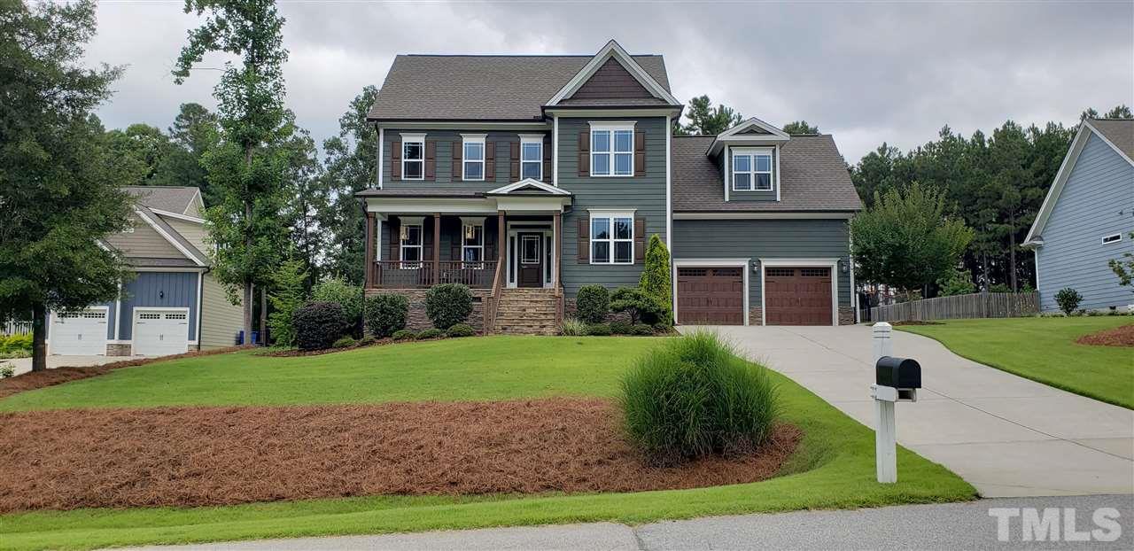 2021 Sageleaf Court Raleigh, NC 27603 - Photo 1 of 20 a front view of a house with a yard