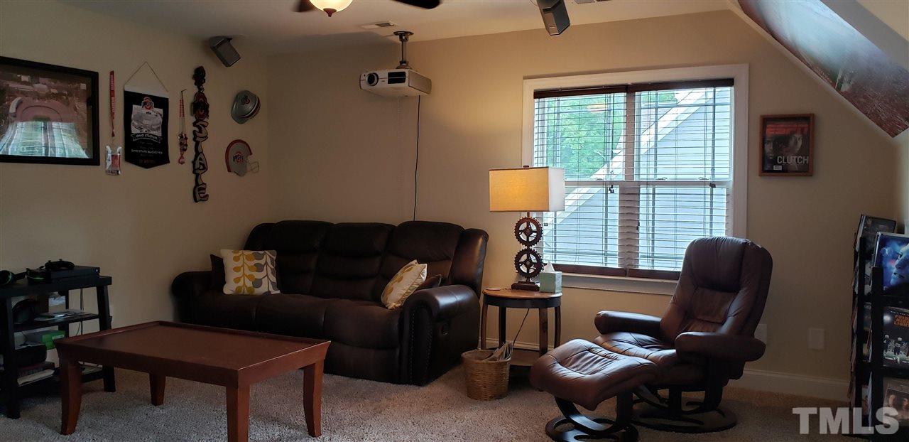 2021 Sageleaf Court Raleigh, NC 27603 - Photo 16 of 20 a work room with furniture and windows