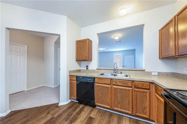 a kitchen with a sink and cabinets