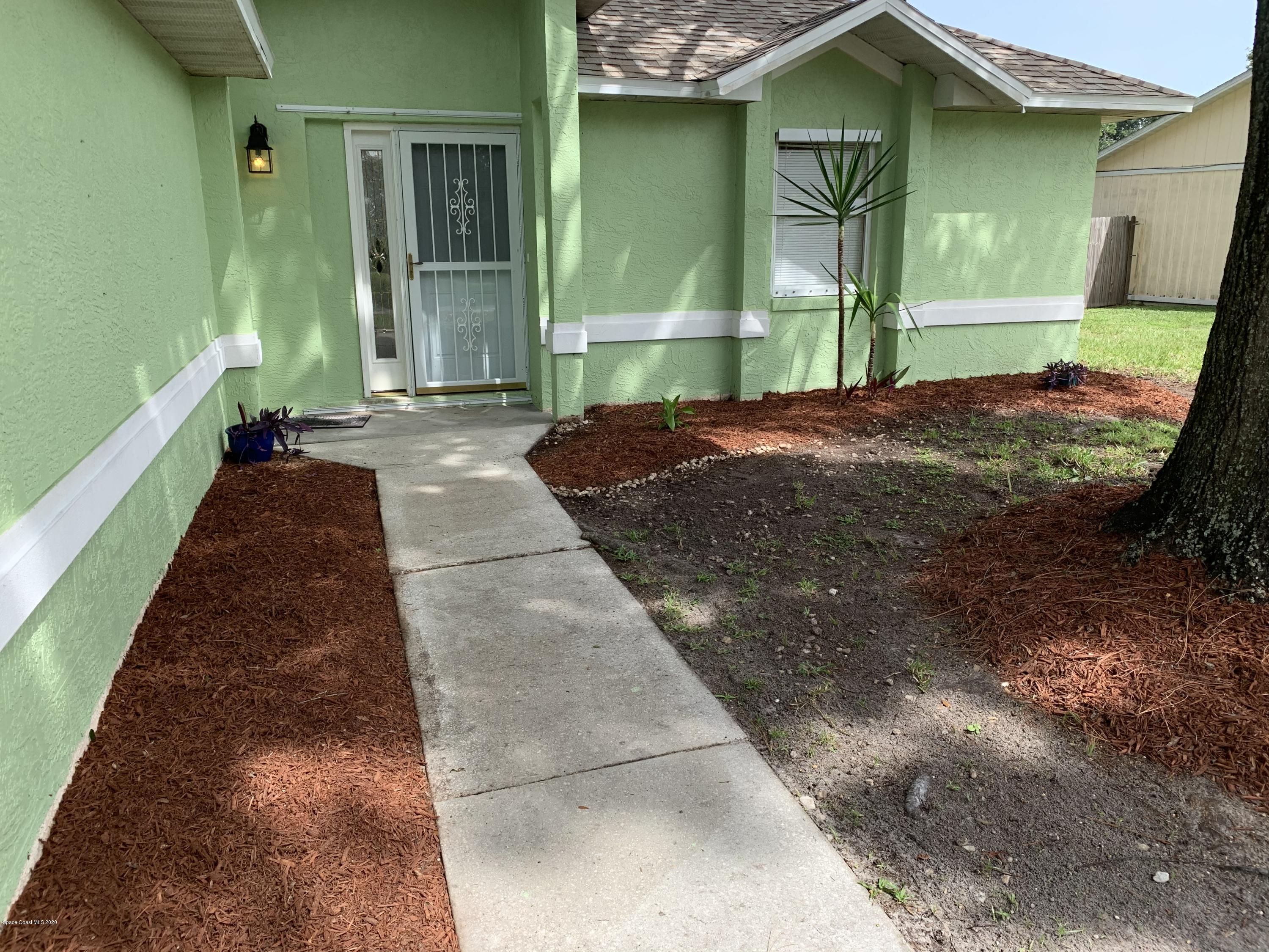 6148 Corning Road Cocoa, FL 32927 - Photo 21 of 22 Front walk & door