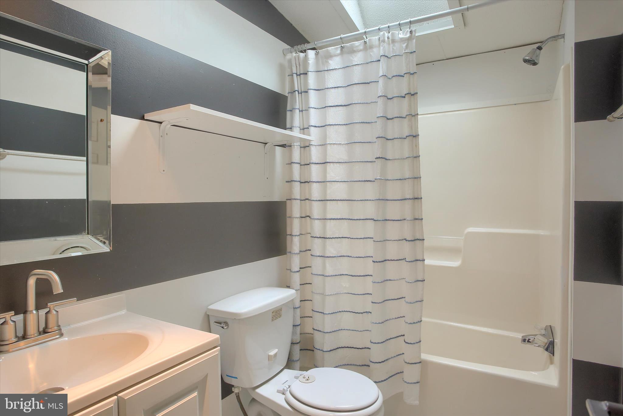 1550 Williams Grove Road, Unit 101 Dillsburg, PA 17019 - Photo 11 of 22 a bathroom with a sink toilet and shower