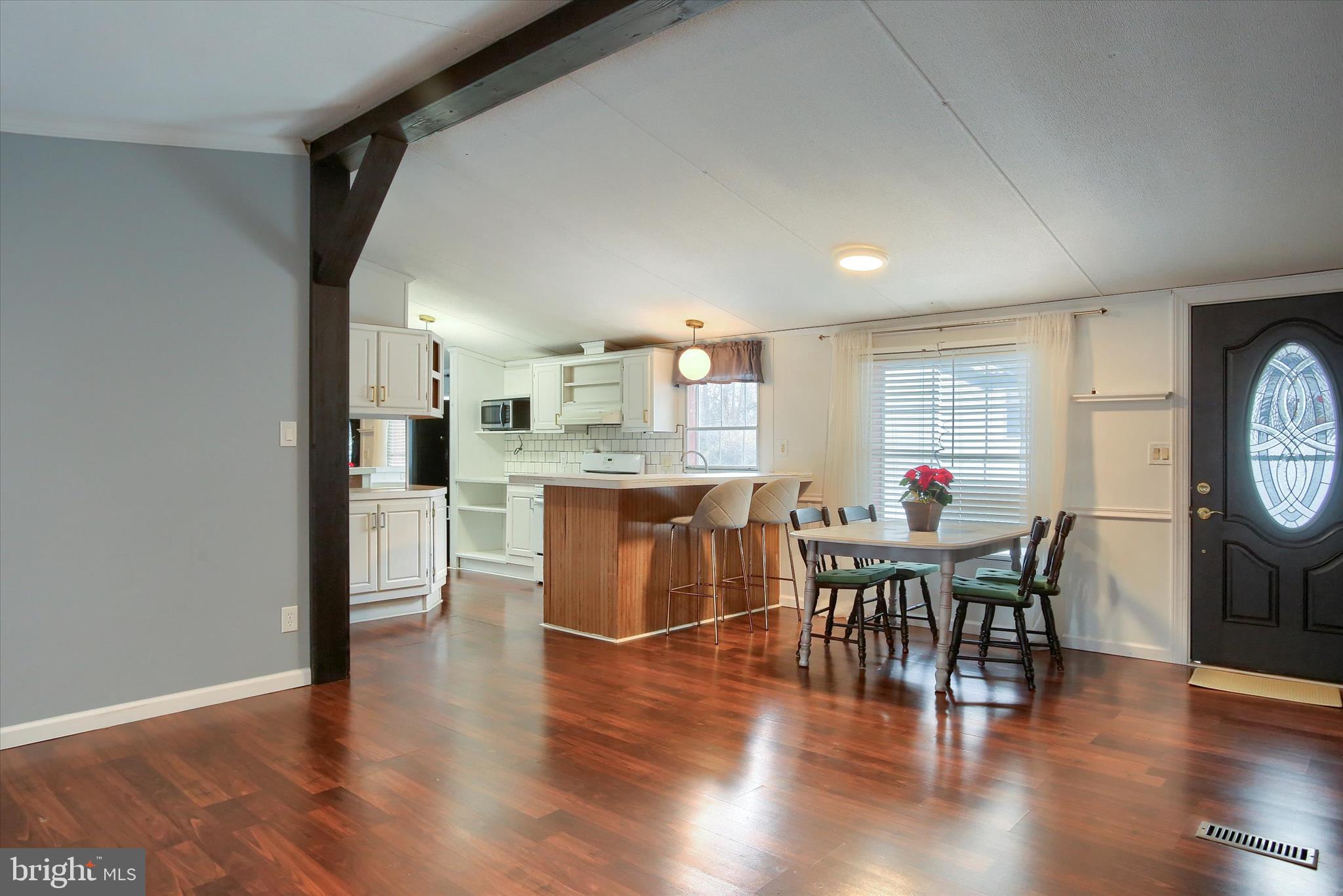 1550 Williams Grove Road, Unit 101 Dillsburg, PA 17019 - Photo 4 of 22 a view of a dining room with furniture and wooden floor