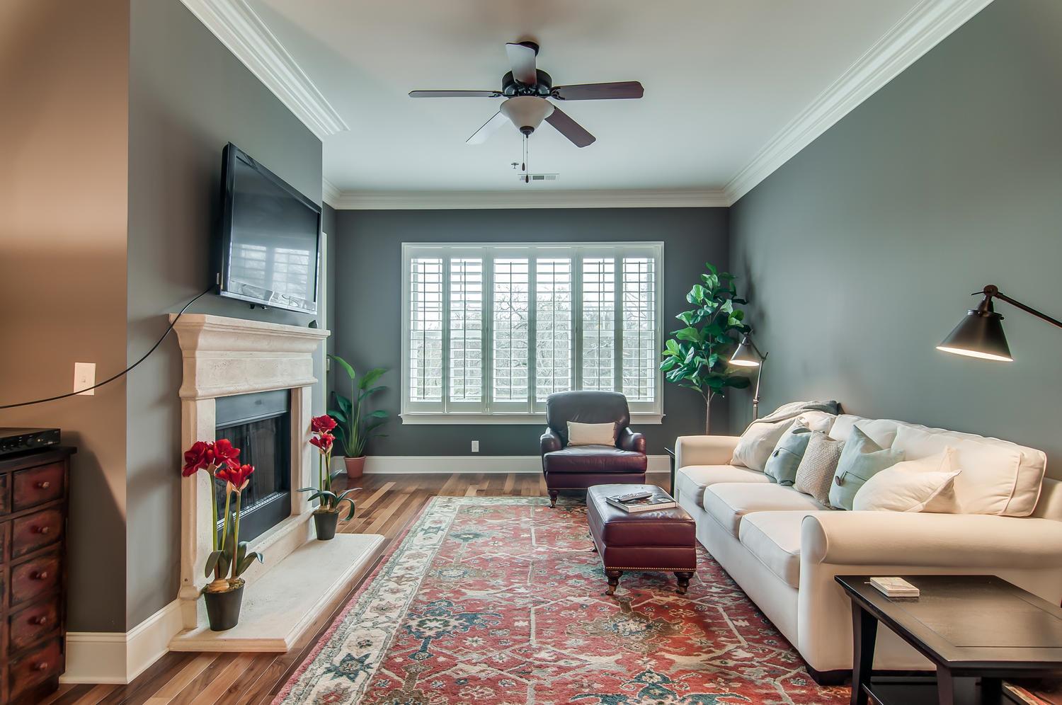 a living room with furniture and a flat screen tv