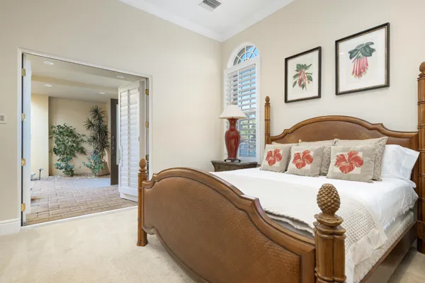 a bedroom with a bed and couch