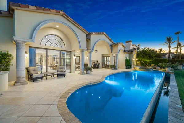 a view of a swimming pool with a lake view