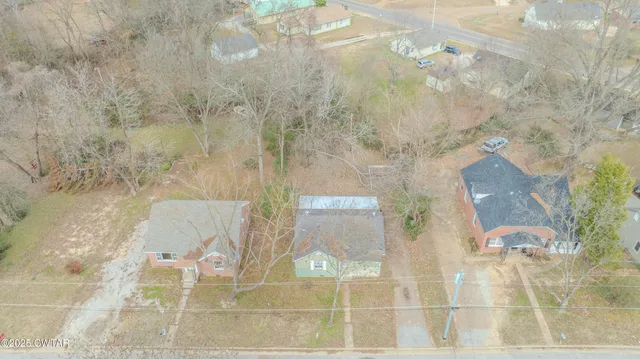 a house with trees in front of it