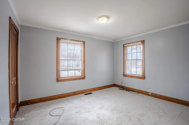 an empty room with windows