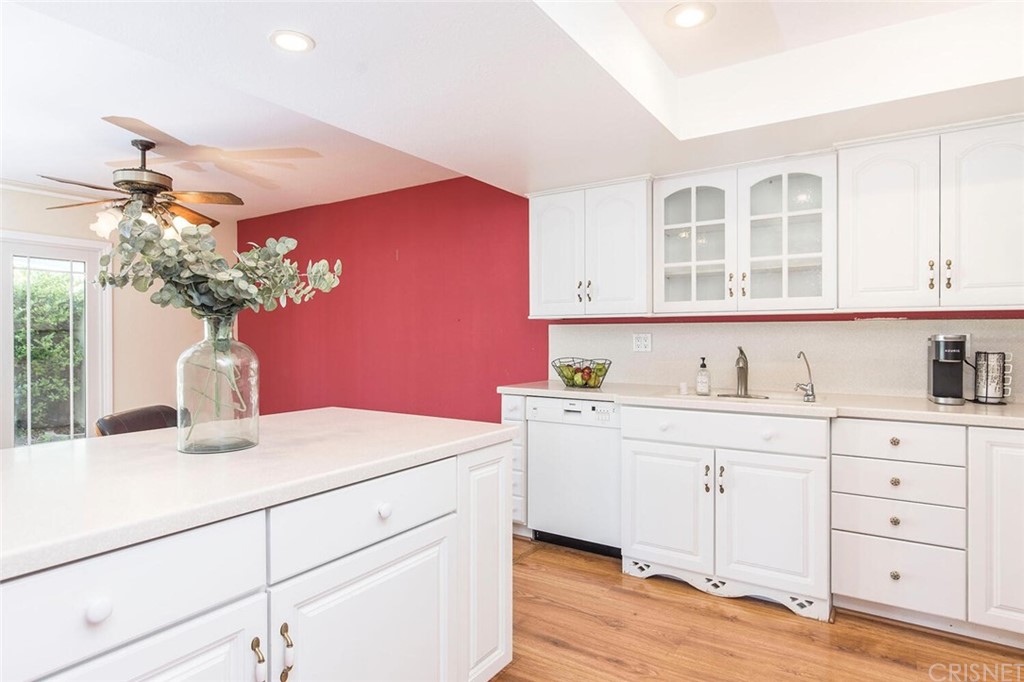 27003 Rio Prado Drive Valencia, CA 91354 - Photo 11 of 27 a kitchen with a sink and cabinets