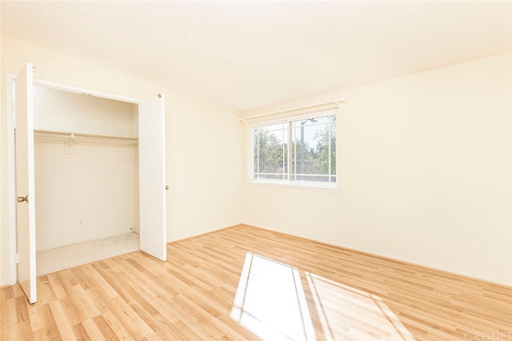 27003 Rio Prado Drive Valencia, CA 91354 - Photo 17 of 27 a bedroom with a bed and a window