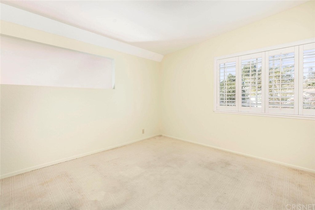 27003 Rio Prado Drive Valencia, CA 91354 - Photo 18 of 27 an empty room with a window