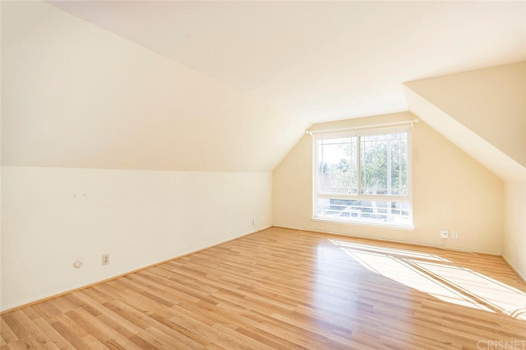 27003 Rio Prado Drive Valencia, CA 91354 - Photo 19 of 27 an empty room with wooden floor and windows