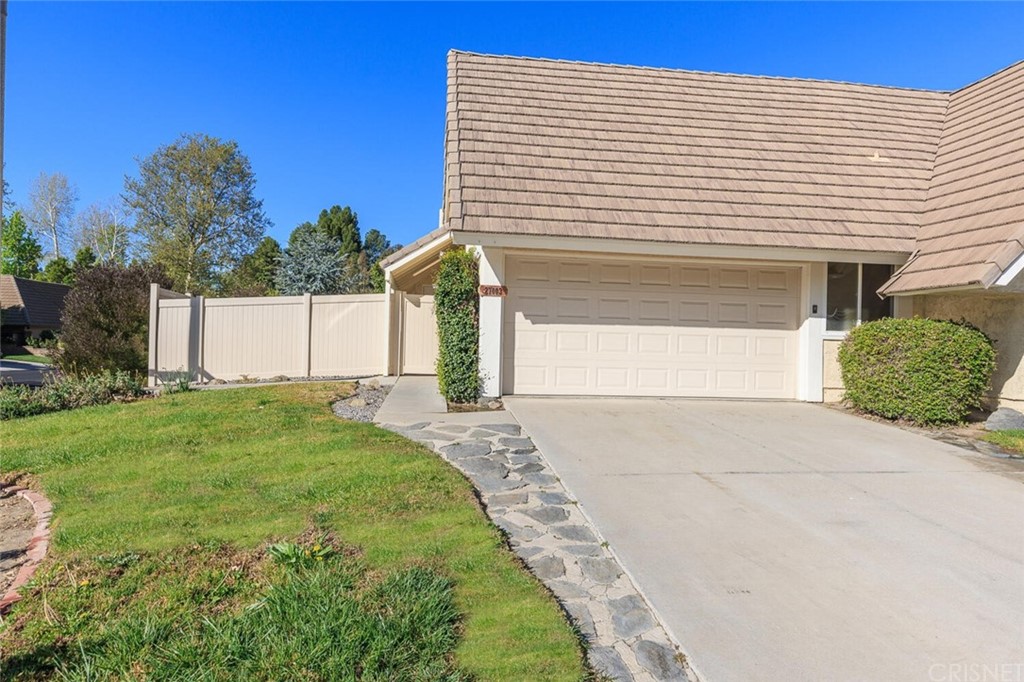 27003 Rio Prado Drive Valencia, CA 91354 - Photo 2 of 27 a front view of a house with garden