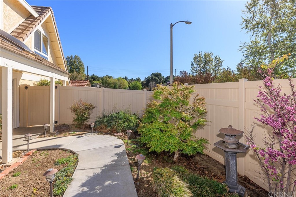 27003 Rio Prado Drive Valencia, CA 91354 - Photo 27 of 27 a view of a garden with a lake