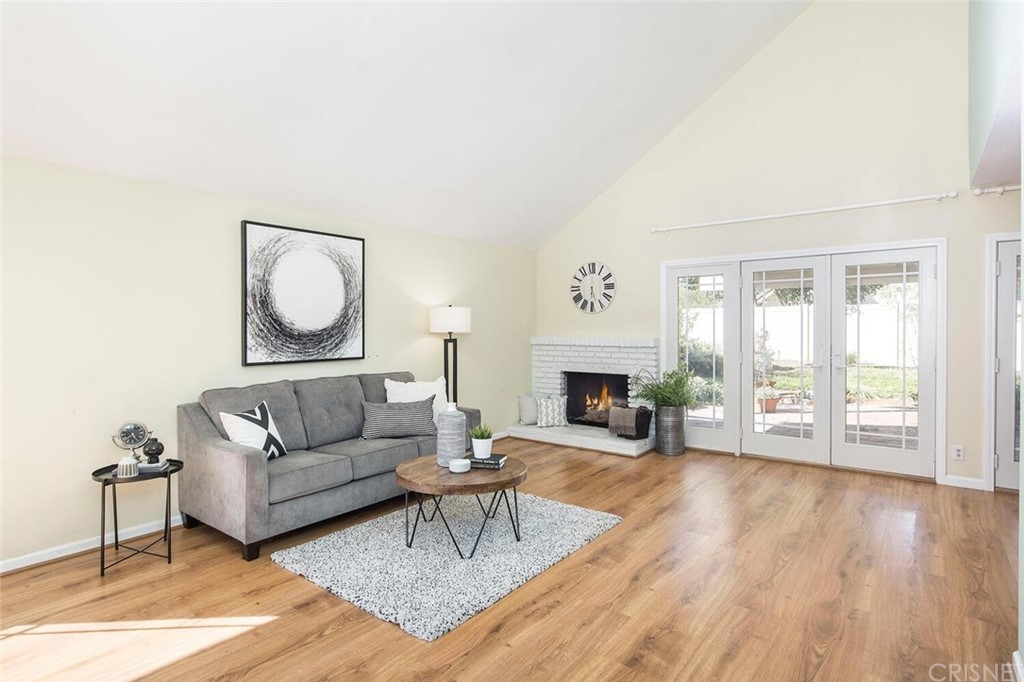 27003 Rio Prado Drive Valencia, CA 91354 - Photo 7 of 27 a living room with fireplace furniture and a wooden floor