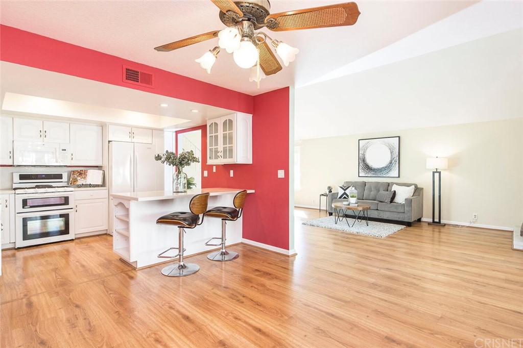 27003 Rio Prado Drive Valencia, CA 91354 - Photo 9 of 27 a living room with furniture and kitchen view