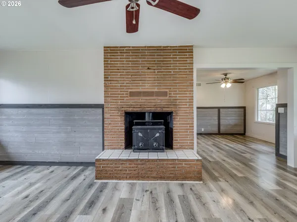 a view of fireplace and wooden floor