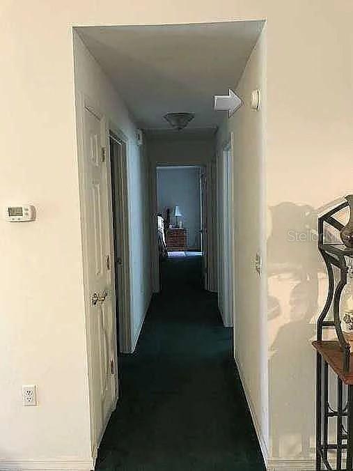 363 Southwest Monroe Avenue Mayo, FL 32066 - Photo 11 of 12 a view of a hallway with a white walls