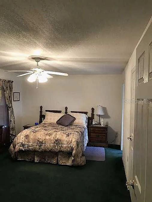 363 Southwest Monroe Avenue Mayo, FL 32066 - Photo 12 of 12 a bedroom with bed and window