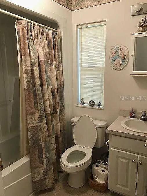 363 Southwest Monroe Avenue Mayo, FL 32066 - Photo 9 of 12 a bathroom with a toilet a sink and a shower