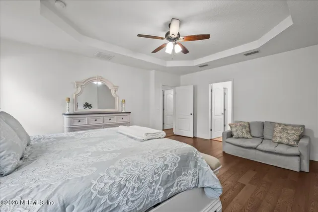 a large bathroom with a sink a mirror and a bathtub
