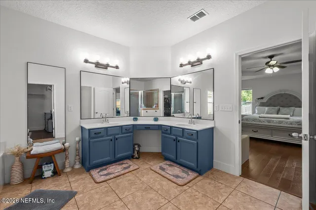 a living room with furniture and a dining table with wooden floor