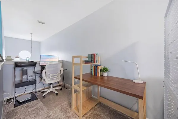 a view of a workspace with furniture