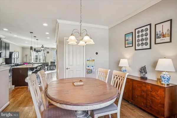 a kitchen with granite countertop a refrigerator stove and kitchen island