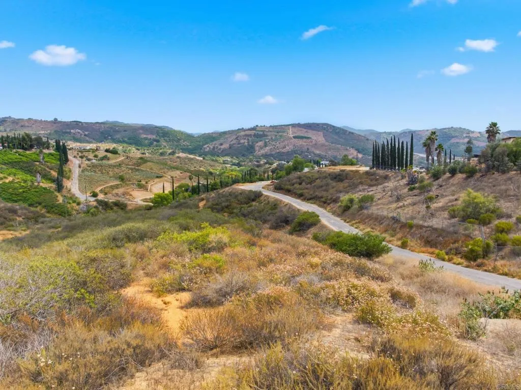 127 Rocking Horse Road Escondido, CA 92026 - Photo 6 of 11 a view of a town with mountains in the background