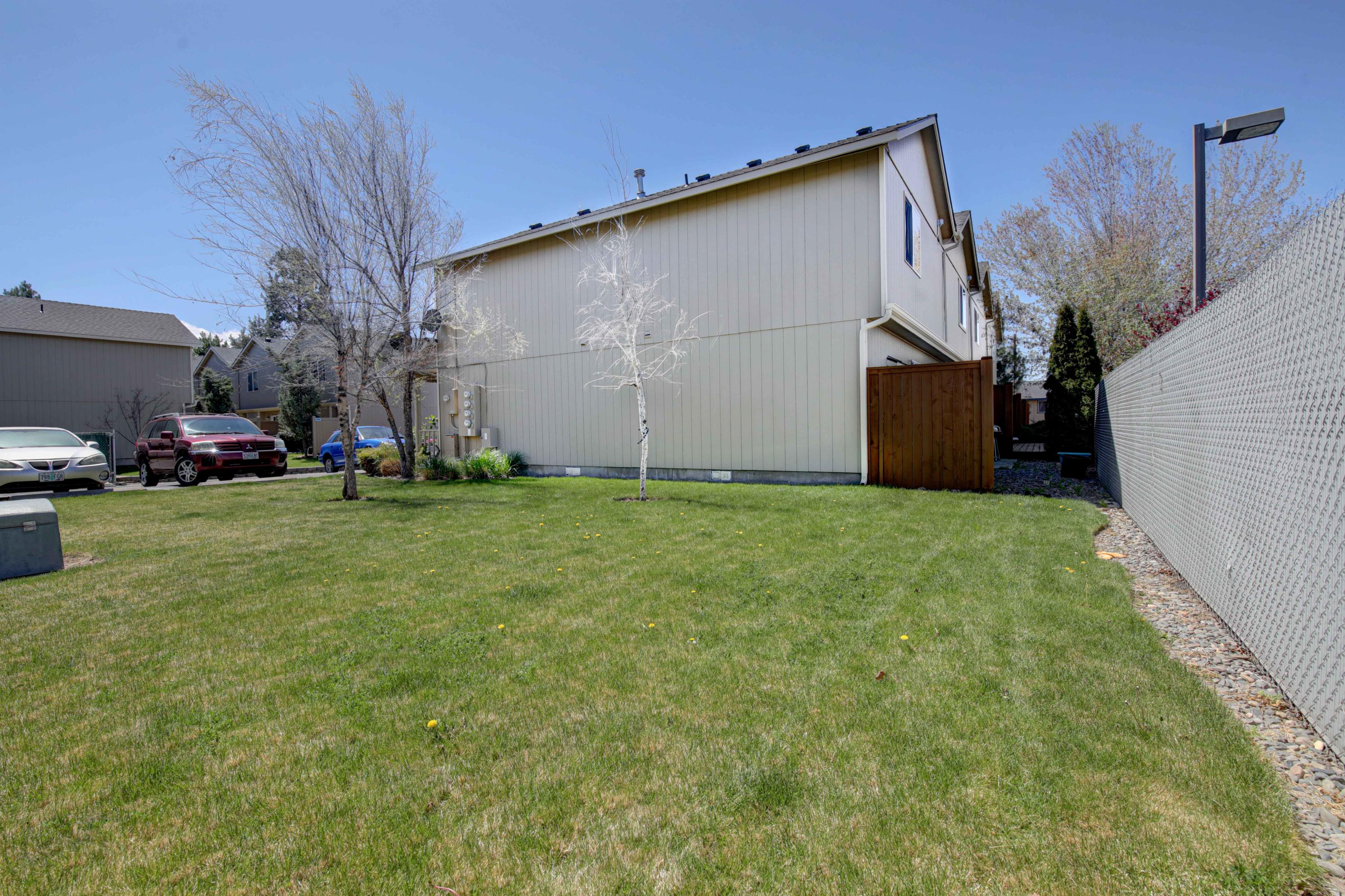 1446 Southwest 16th Street Redmond, OR 97756 - Photo 16 of 17 Common green space next to the home.