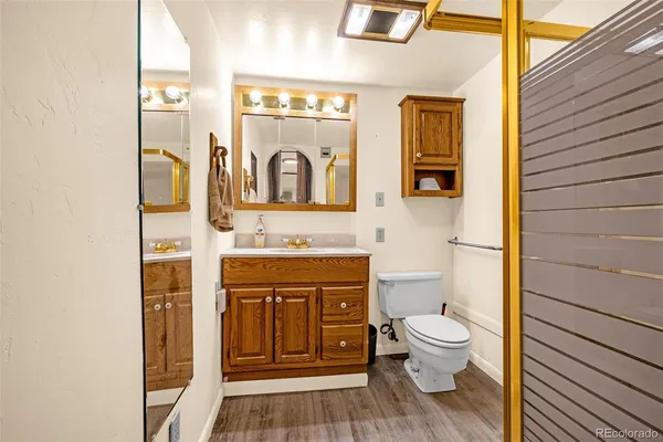 a white toilet sitting next to a bathroom sink