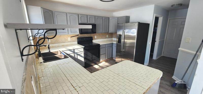 351 Thumper Drive Ranson, WV 25438 - Photo 13 of 45 Modern kitchen with sleek finishes.
