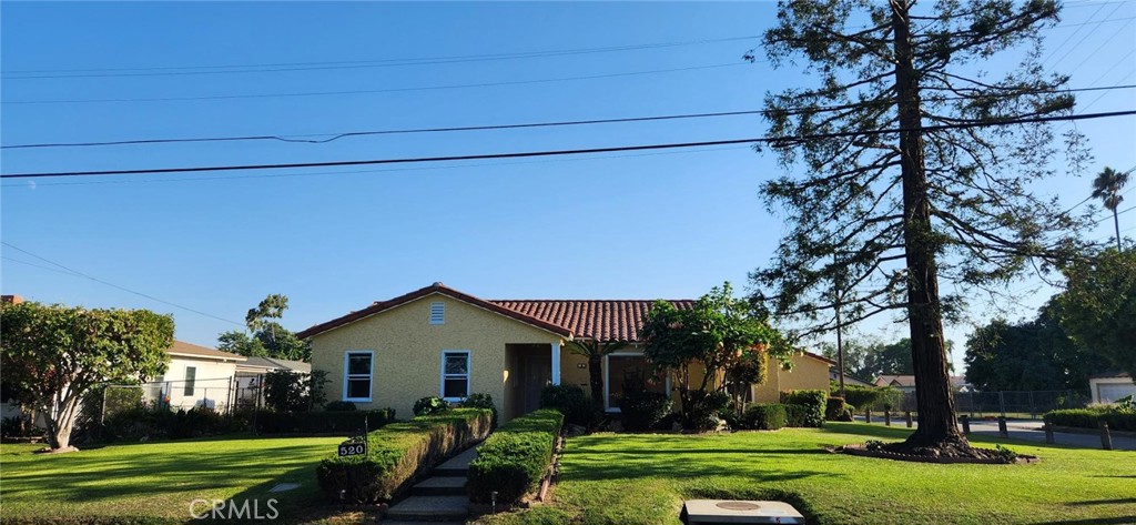 520 West Raymond Street Compton, CA 90220 - Photo 13 of 31 a front view of a house with a yard and garage