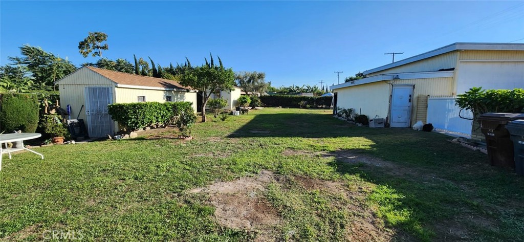 520 West Raymond Street Compton, CA 90220 - Photo 17 of 31 a front view of a house with garden