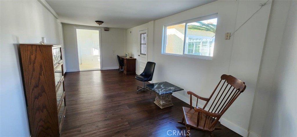 520 West Raymond Street Compton, CA 90220 - Photo 22 of 31 a view of room with wooden floor and windows