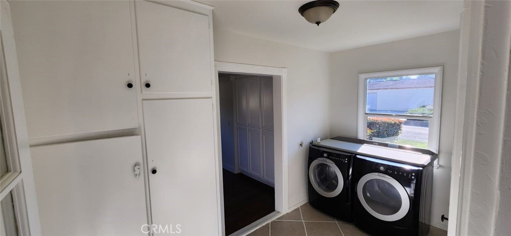 520 West Raymond Street Compton, CA 90220 - Photo 23 of 31 a view of storage and utility room with washer and dryer