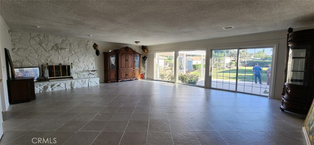 520 West Raymond Street Compton, CA 90220 - Photo 26 of 31 a view of empty room with wooden floor and fireplace