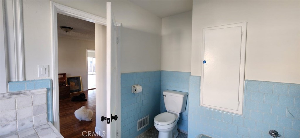 520 West Raymond Street Compton, CA 90220 - Photo 29 of 31 a bathroom with a toilet and a shower