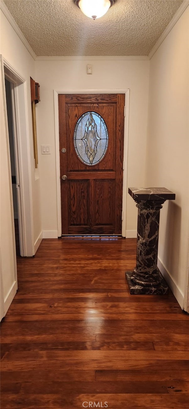 520 West Raymond Street Compton, CA 90220 - Photo 3 of 31 a view of a hallway with wooden floor
