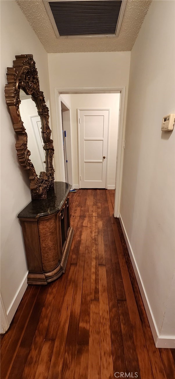 520 West Raymond Street Compton, CA 90220 - Photo 5 of 31 a view of a livingroom with wooden floor and white walls