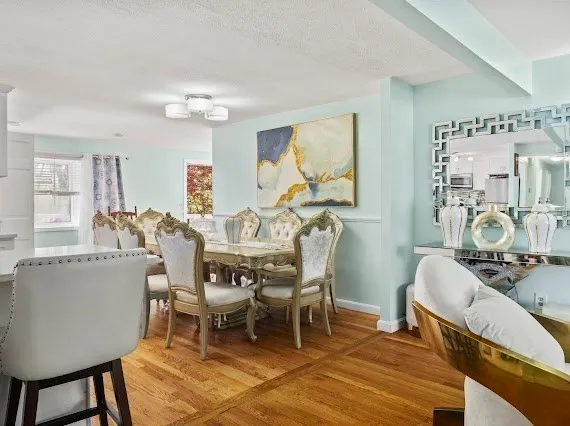a dining room with furniture and window