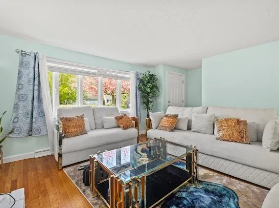 a living room with furniture and a large window