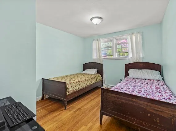 a bedroom with a bed and window