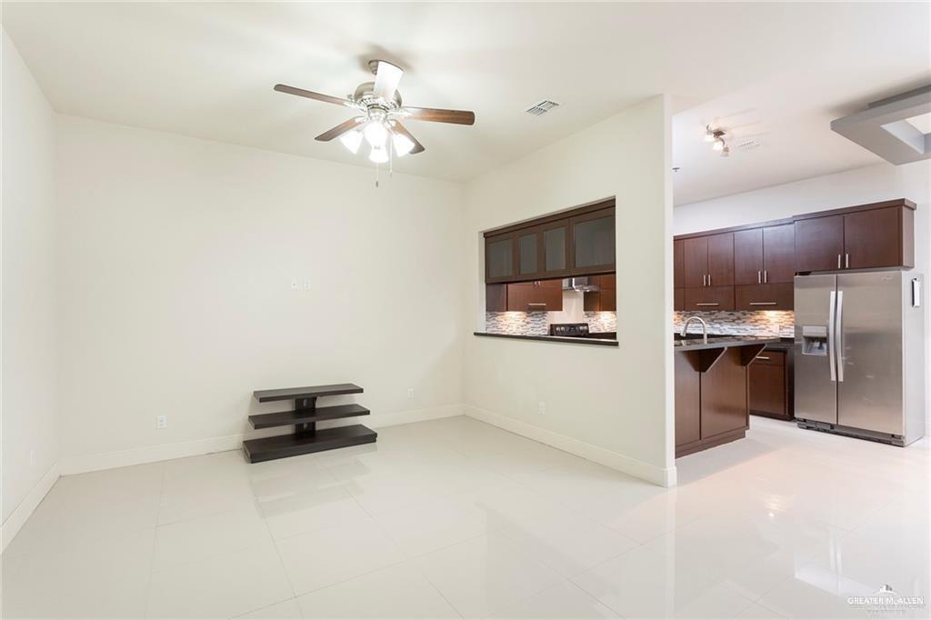 3016 South L Street, Unit 2 McAllen, TX 78503 - Photo 2 of 10 a view of kitchen with cabinets microwave and stove