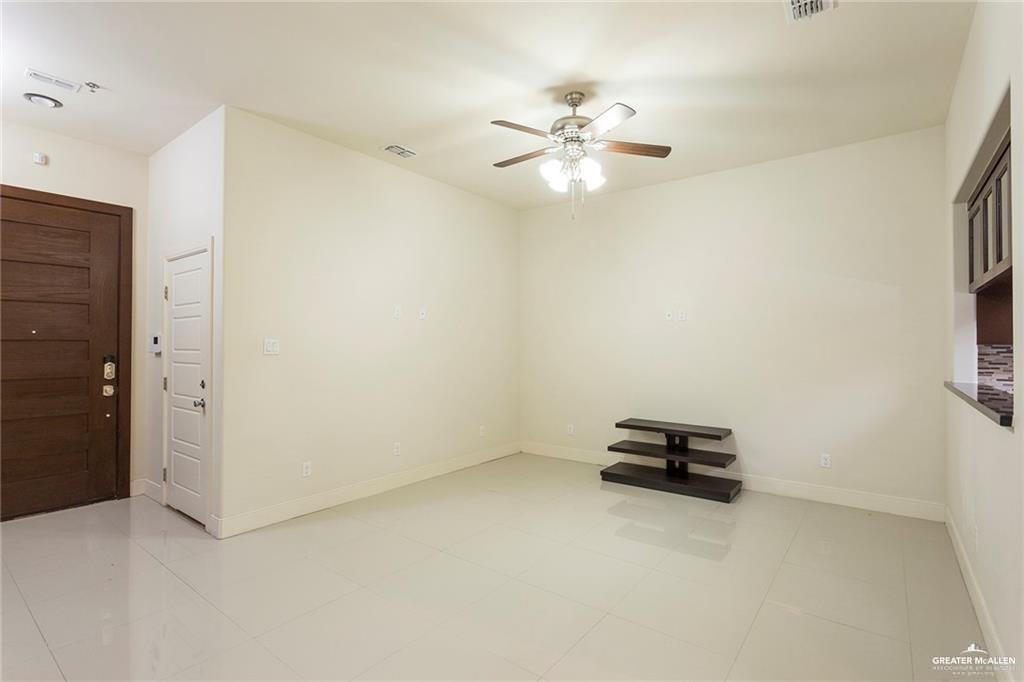 3016 South L Street, Unit 2 McAllen, TX 78503 - Photo 4 of 10 an empty room with windows and fan