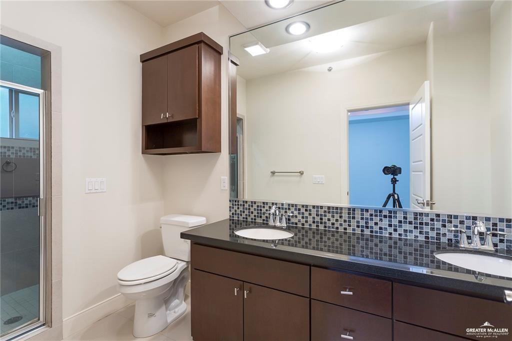 3016 South L Street, Unit 2 McAllen, TX 78503 - Photo 9 of 10 a bathroom with a sink and a toilet