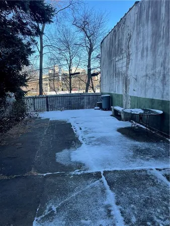 a view of backyard with outdoor seating