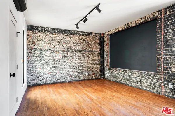 a view of wooden floor in an empty room