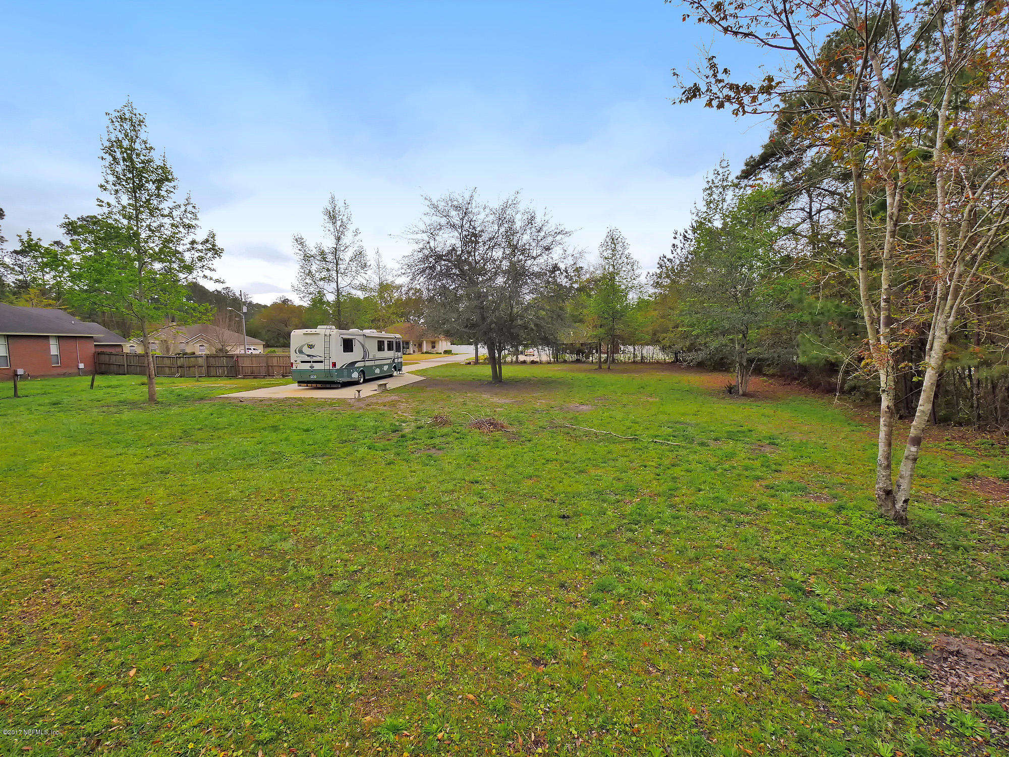 Lot Yellow Yellow Bluff Road Jacksonville, FL 32226 - Photo 5 of 16 a view of a field with of trees in the background